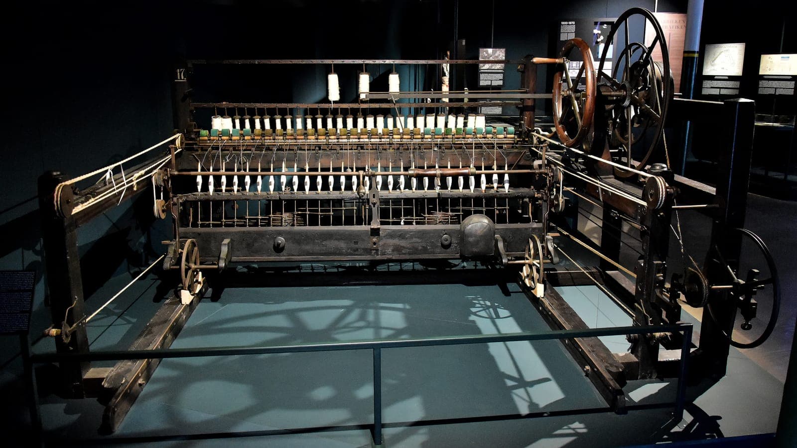 Spinning mule in a textile museum, the factory machine that replaced cottage spinning in the Industrial Revolution, for a 6/6 AP World History LEQ essay